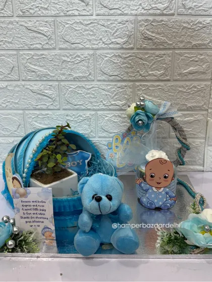 The full baby pram hamper set on an elegant silver MDF base.