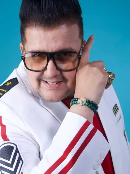 A close-up shot showcasing my unique style. The custom jacket, the glasses, the rings – it's all part of the DJ Alex Mumbai persona.