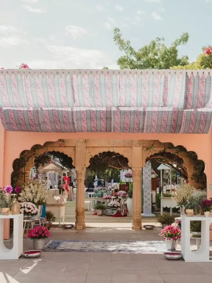 The entrance to a daytime event at Suryagarh, Jaisalmer. The decor blends traditional Rajasthani architecture with soft, modern aesthetics.