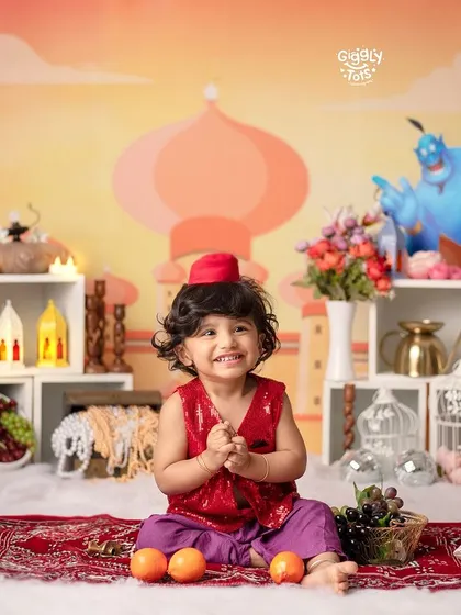 Let's go on a magical adventure! My themed photoshoots, like this vibrant Aladdin setup, are designed to bring your child's favorite stories to life with detailed props and costumes.