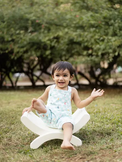 A big, happy laugh from this little one during his outdoor sitter session. The natural light is perfect for capturing these bright and airy portraits.