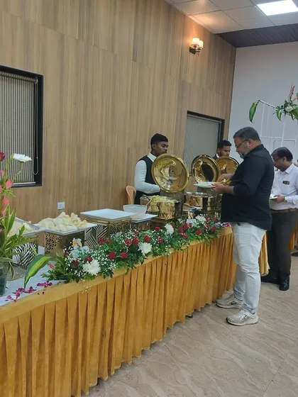 Guests being served at a formal buffet line, highlighting the smooth and professional service my team provides during an event.