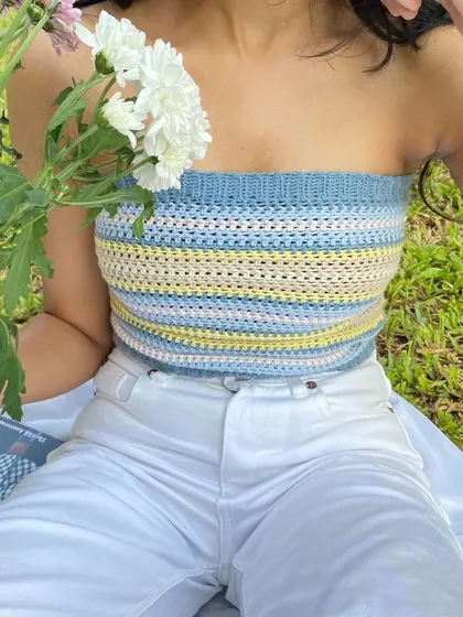 Our striped tube top is perfect for a picnic or a day at the beach. Here it is styled for a soft, cottagecore aesthetic.
