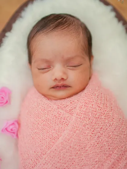 This close-up highlights the tiny, perfect details of a newborn. My professional lighting and camera gear are set up to capture every delicate feature, from eyelashes to tiny lips, in sharp, beautiful focus.