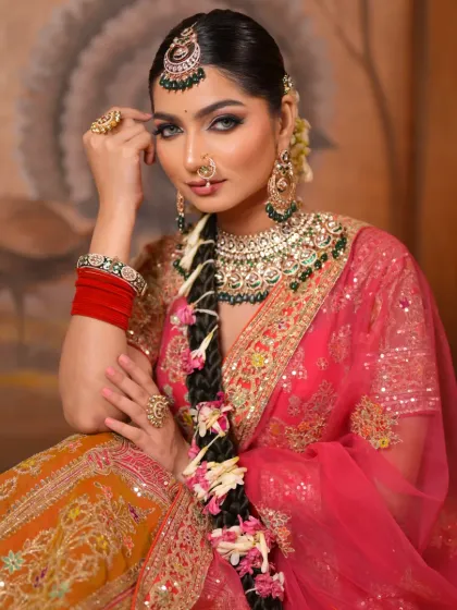 This close-up shot highlights the intricate details of her makeup and jewelry. The sharp eye makeup and flawless skin create a look of breathtaking beauty.