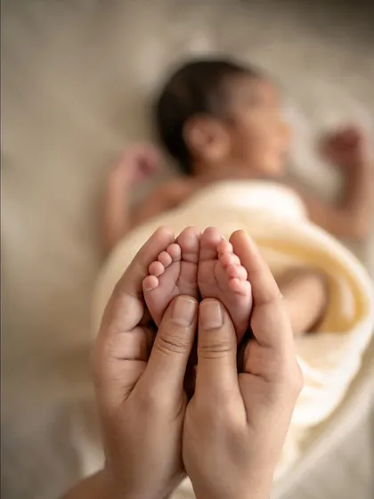 Those tiny feet make the biggest footprints in our hearts. This is the kind of fleeting, tender moment I live to capture, a simple reminder of how small they once were.