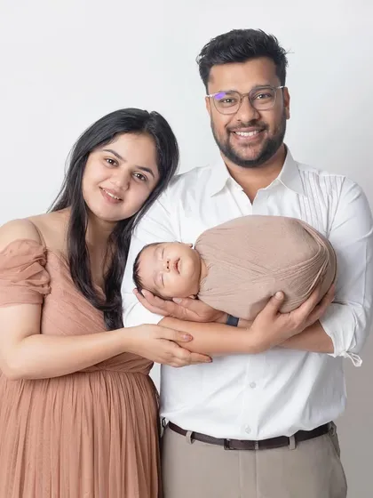 A new baby brings so much warmth and light. This beautiful family portrait with their newborn is full of happiness and love.