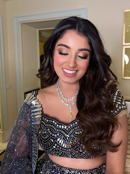 A close-up of the bridesmaid's happy expression and her lovely, soft waves.