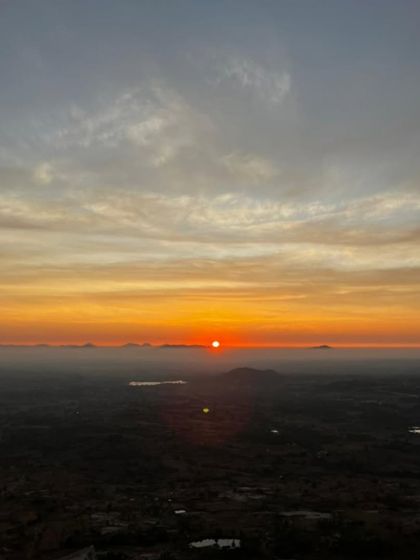 A stunning, wide view of the sunrise, with the orange and yellow sky stretching across the horizon.