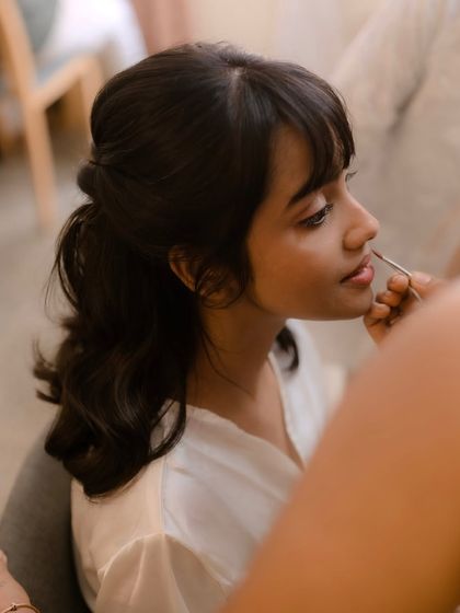 A behind-the-scenes moment of me working on my bride Shruti. I truly love my job and the connection I build with my brides.