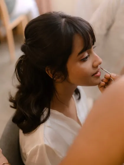 A behind-the-scenes moment of me working on my bride Shruti. I truly love my job and the connection I build with my brides.
