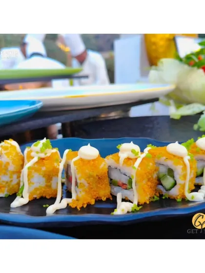 Crispy tempura sushi rolls drizzled with mayonnaise, a popular choice from our live sushi counter.