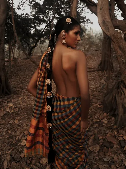 An artistic interpretation of tradition, shot outdoors in a natural setting. This image showcases my love for creating earthy, soulful portraits that blend cultural aesthetics with a modern, editorial sensibility.