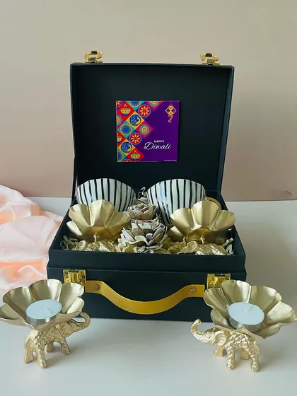 The complete set, showcasing the black suitcase box with the ceramic cups and matching elephant T-light holders displayed outside. It’s a perfect ready-to-gift set for Diwali.