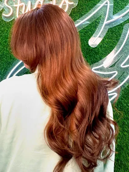 Chocolate and warm brown bliss. This color looks stunning against our salon's green wall.