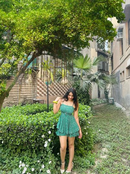 A cute green printed romper for a spring day. This outfit is all about fresh, fun, and youthful energy.