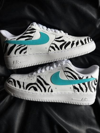 A pair shot of the zebra stripe custom sneakers.