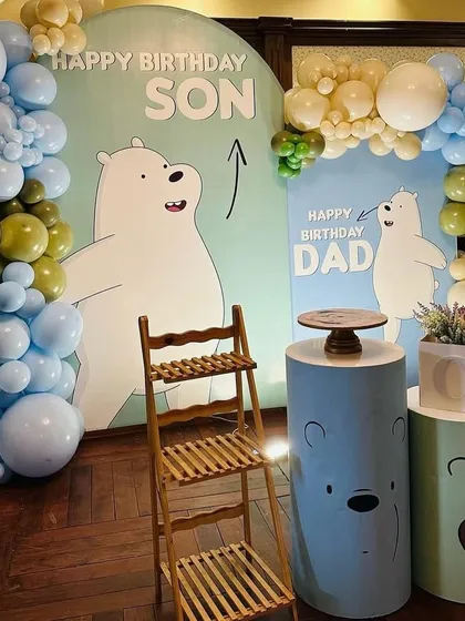 A different angle of the "We Bare Bears" party, showing the setup from the side. This view highlights the depth of the balloon garlands and the placement of the themed plinths.