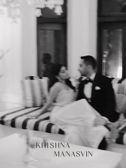 A blurry, artistic shot from a glamorous cocktail party. This image captures the energy and movement of the night, feeling like a fleeting, dreamlike memory of a perfect evening.
