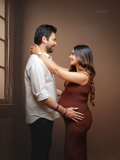 A warm and intimate couple's portrait from an at-home session. We bring our backdrops and lighting to create studio-quality images in the comfort of your home.