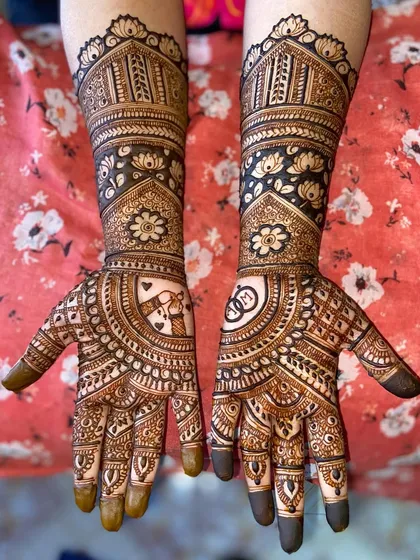 A clear, full view of the heart and rings mehandi, showing how the personal touches are beautifully integrated into the traditional design.