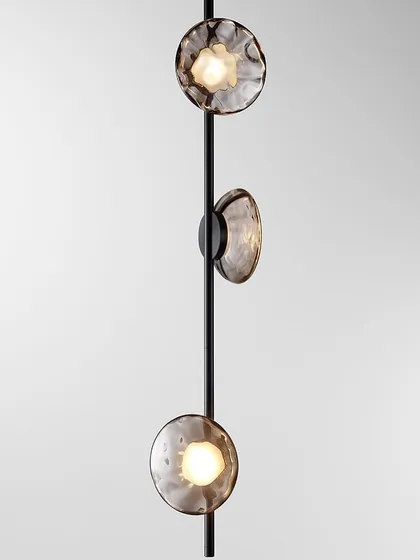 The Ceto collection includes this vertical pendant, which can be used to create dramatic linear statements in stairwells or rooms with high ceilings. It is customizable in different sizes and finishes.