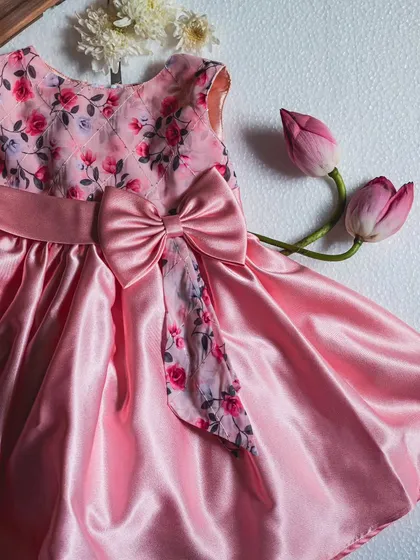 This design combines a classic floral print with the beautiful sheen of pink satin. I added a large, structured bow to create a statement piece that is both sweet and sophisticated, perfect for any special occasion.