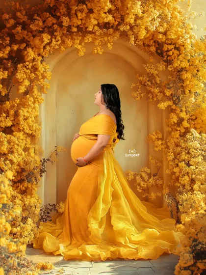 Surrounded by a sea of yellow flowers, this mom-to-be looks radiant in a matching yellow gown. This is one of our elaborate floral setups for a truly immersive experience.