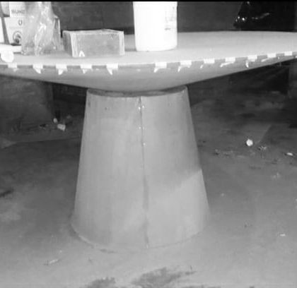 A sculptural dining table in its raw form at our workshop. The metal frame for the base and top has been constructed, and it's now ready for the wood veneering process.