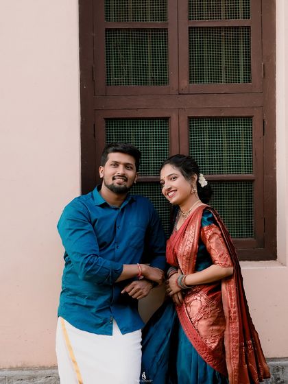 A relaxed portrait against a simple wall with a traditional window. Even simple urban backdrops can create beautiful, clean portraits.