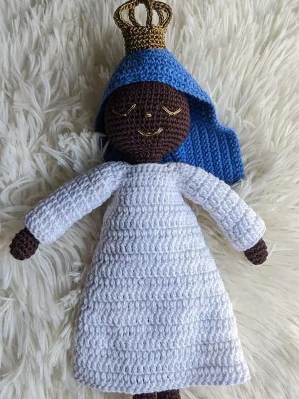 A custom Mother Mary doll with a darker skin tone, showing how I can personalize these figures for you.