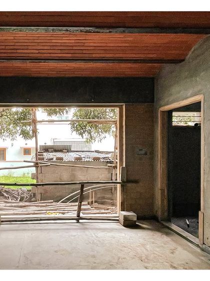 A large window opening at the 'VKR' site, framing the view outside even during construction.