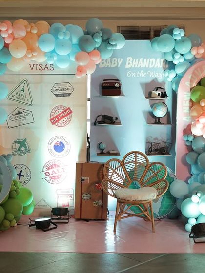 A complete view of a travel-themed stage, featuring passport and visa stamp details, vintage suitcases, and even a miniature Eiffel Tower to inspire a sense of wanderlust.