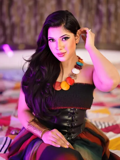 A fusion look combining a strapless top with a leather corset and colorful accessories. This shot highlights my ability to pull off bold, eclectic styles.