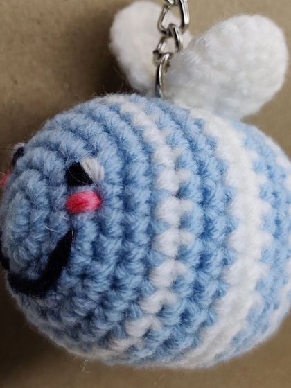 My super popular bumblebee keychains. They come in the classic yellow and black, but I also make them in fun colors like pink, blue, and purple.