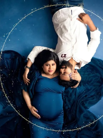 I love creating these dreamy, imaginative scenes. Here, we designed a 'moon and stars' concept to capture the universe of love this couple is creating as they wait for their little one.