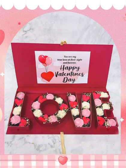 A "LOVE" box filled with our Cupid Cupcakes for Valentine's Day. Each letter is filled with beautifully decorated mini cupcakes, creating a grand romantic gesture.