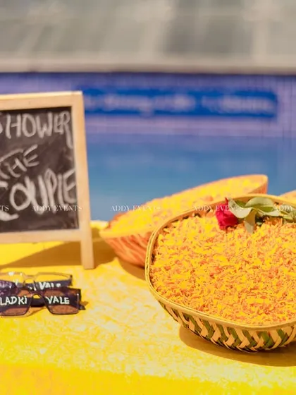 The "Shower the Couple" station, complete with baskets of marigold petals and fun sunglasses for the "Ladkiwale" and "Ladkewale."