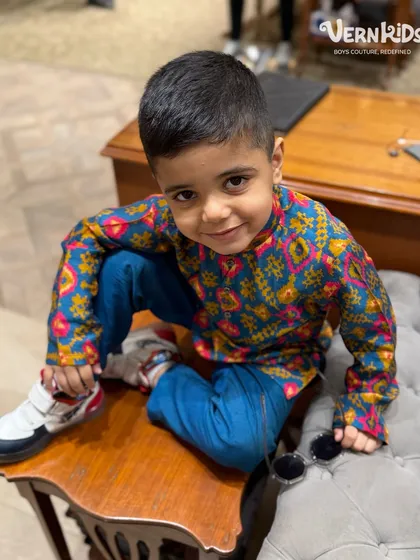This little client is all about color, comfort, and cuteness in our vibrant printed kurta set. It's the perfect festive-ready look for boys who love to play.