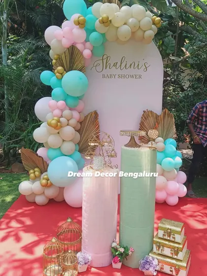 This pastel baby shower is a great example of how we mix colors and textures. The combination of mint, pink, and white balloons with gold palm leaves creates a chic and modern look. It was such a joy to create this for a regular client celebrating her fourth event with us.