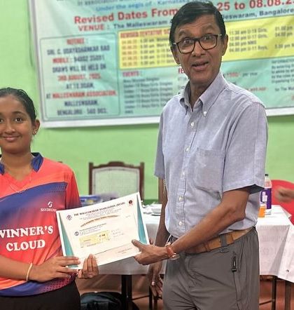 Rashi V Rao receiving her certificate for securing 2nd place in the Under 15 Girls Singles category.