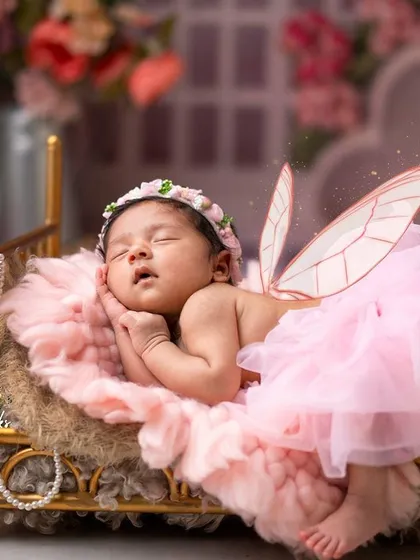 The magic of new life is captured in this enchanting butterfly-themed newborn shoot. We style every detail, from the delicate wings to the floral setting, to turn your baby's first portraits into a fairytale.