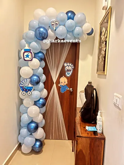 A charming "Welcome Home Baby Boy" door decoration. The blue and white balloon arch is a wonderful way to greet the newborn and new mother as they arrive home.