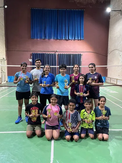 A group of proud winners from a summer camp tournament I managed. My goal is to create an environment where every player, from young kids to adults, gets a chance to compete and celebrate their success.