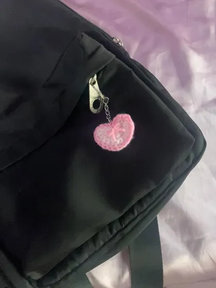 A closer look at the pink heart keychain. You can see the handmade stitches and the little chain I use to attach it.