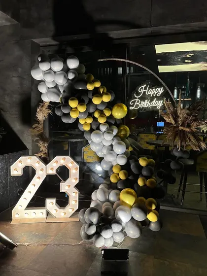 The perfect backdrop for a 23rd birthday celebration. The contrast of the industrial-style venue with our chic balloon decor created a memorable photo spot.