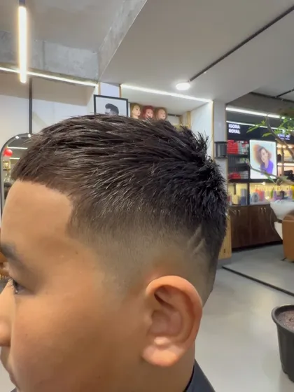 A close-up of the low fade, showing the seamless transition from the longer hair on top to the shorter sides.