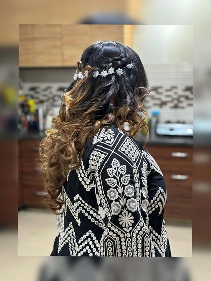 Another beauty, ready for a wedding function. This image shows her beautiful hairstyle with delicate accessories and soft curls.