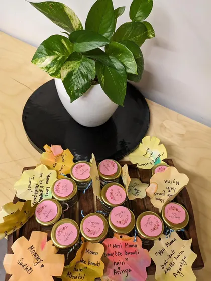 For Mother's Day, children engaged in a multi-sensory culinary project. They scooped aloe vera gel and crushed rose petals to create a special gift. This practical life skill activity also involves measuring, pouring, and mixing.