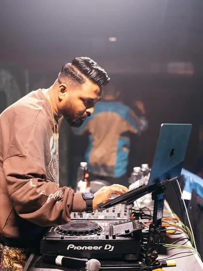 A side profile of me at the decks at antiSOCIAL. The industrial, underground vibe of the venue is perfect for a raw hip hop set.